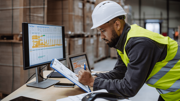 A warehouse employee is frustrated by delivery and fulfillment errors